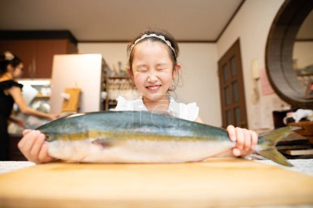 Photo for Girl with a big fish - Royalty Free Image