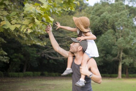 Photo for Father and daughter playing with a piggyback - Royalty Free Image