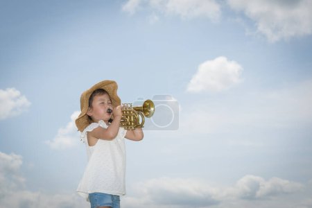 Photo for Little Girl to play the trumpet - Royalty Free Image