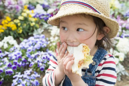 Girl eating a sandwich 
