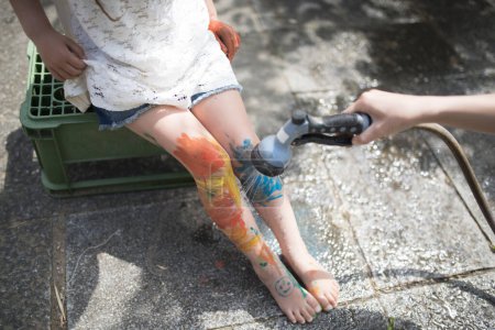 Little girl playing with paint