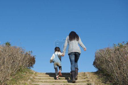 Photo for Mother and daughter playing in the park - Royalty Free Image