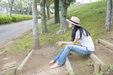 Photo for Woman who sit in the park - Royalty Free Image