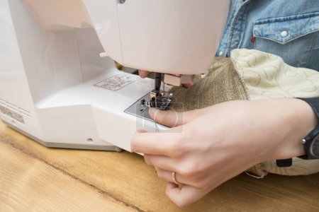 Photo for Woman who use a sewing machine - Royalty Free Image