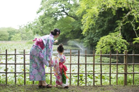 Photo for Mother and daughter to the dressing of yukata - Royalty Free Image