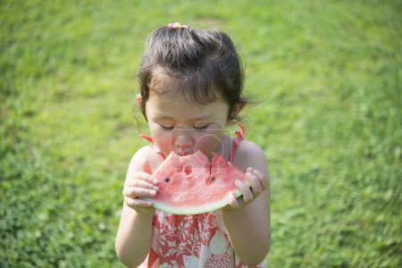 Photo for Girl eating watermelon in summer - Royalty Free Image