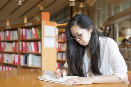 Photo for Women to study at library - Royalty Free Image