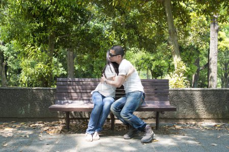 Photo for Couple to a hug on bench - Royalty Free Image