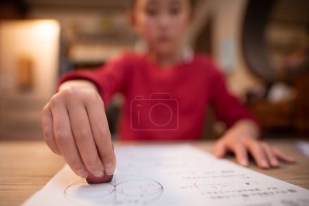 Photo for A child who uses an eraser - Royalty Free Image