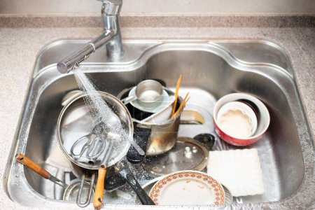 Photo for A sink full of dishes - Royalty Free Image