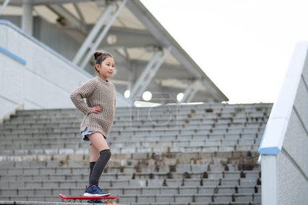 Photo for Girl playing on a skateboard - Royalty Free Image