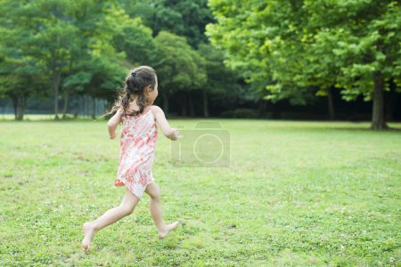 Photo for Happy Little Girl running barefoot - Royalty Free Image