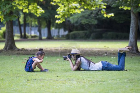 Photo for Mother taking pictures of her daughter - Royalty Free Image