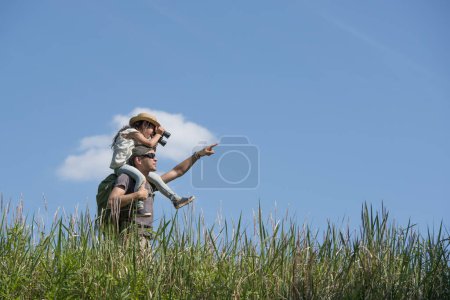 Photo for Father and daughter playing on meadow - Royalty Free Image