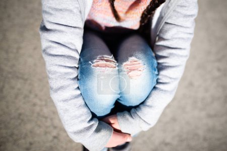 Photo for Girl  in ripped  jeans outdoors - Royalty Free Image