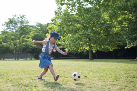 Photo for Little girl playing with a soccer ball - Royalty Free Image