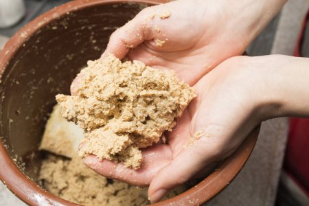 Photo for Woman's hands making rice bran pickles - Royalty Free Image