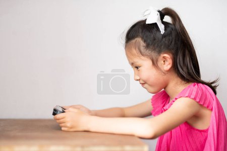 Girl playing game at home