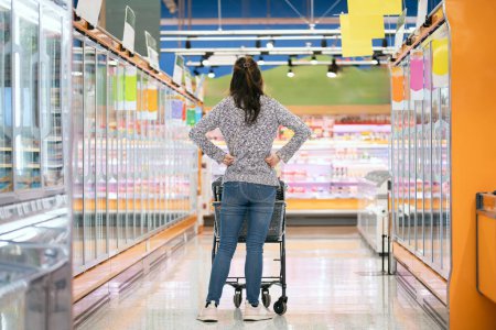 Photo for A woman worried at the supermarket - Royalty Free Image