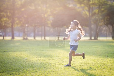 Photo for Girl running on the lawn - Royalty Free Image