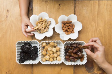Nuts and dried fruits on table