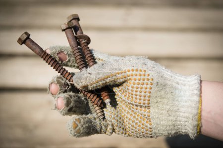Photo for Hand with rusted screws - Royalty Free Image