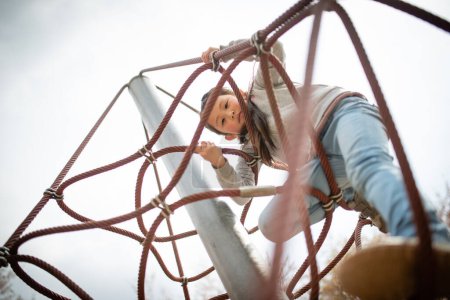 Photo for Little Girl playing in the park - Royalty Free Image