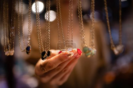 Woman's hands choosing accessories at the store