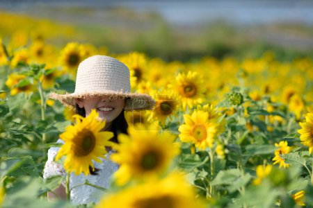 Photo for Asian cute girl  in sunflower field - Royalty Free Image