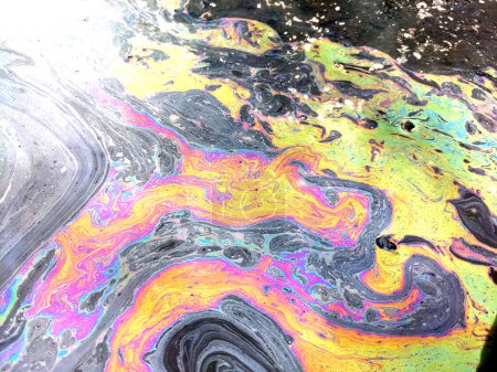 A Oil Petrol Pollution Rainbow Gasoline Leak on Pavement