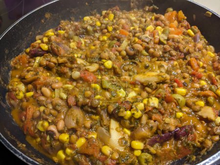 A Close Up of Vegan Stew in a Pan with Lentils and Vegetables and Beans Healthy Meal
