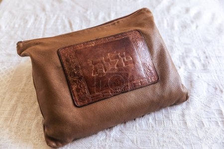 Photo for A Tallit bag,  a pouch saying "talit" in Hebrew on it, Jewish symbols. - Royalty Free Image