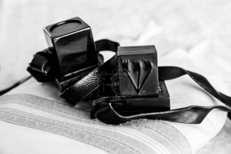 Photo for Close-up photo of tefillin and tallit. A symbol of the Jewish people. Black and white. - Royalty Free Image