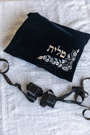 Photo for A set of tefillin (jewish symbol) with verses from Torah written in them and a pouch saying "tefillin" in Hebrew on it - Royalty Free Image