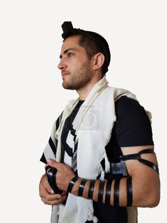 Photo for A jewish man pray with Tallit and Tefillin. On a white background - Royalty Free Image
