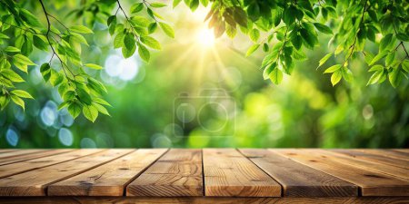 Téléchargez les photos : Table en bois vide avec des feuilles vertes sur fond flou, parfaite pour l'affichage ou le montage de produits - en image libre de droit