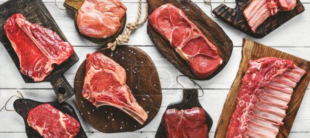 Photo for Set of various raw meat steaks. Fresh meat of beef, pork, veal, chicken, steak t-bone, rib eye, tomahawk, ribs, tenderloin on cutting board over white background. Meat food, butcher shop, top view - Royalty Free Image