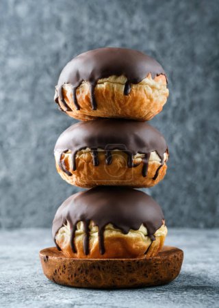 Photo for Donuts with chocolate glaze on grey stone background. Sweets, dessert and pastry, close up - Royalty Free Image