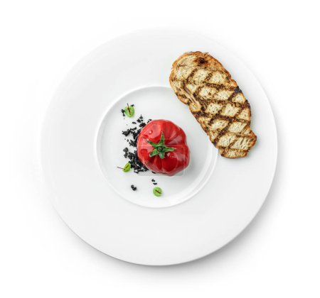 Foto de Paté de carne en forma de tomate con migas de trufa y croutón a la parrilla en plato aislado sobre fondo blanco. Comida saludable, vista superior - Imagen libre de derechos