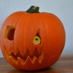 Close-up pumpkin. Carved pumpkin evil face for Halloween
