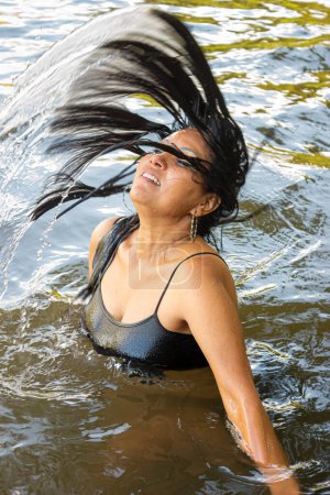 Face of a Hispanic woman in a river in Neiva  Huila - Colombia