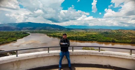 Young Latino with the Magdalena river valley in the background in Gigante - Huila - Colombia