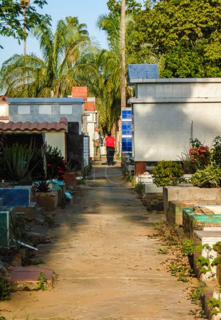Two people standing at the end of a path in the Central Cemetery of Neiva - Huila - Colombia