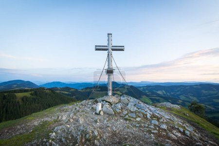 Photo for Summit cross on a rocky peak of the mountain Plankogel in Austria - Royalty Free Image