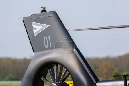 Photo for Fertzentmiklos, Hungary - April 30, 2023: Tail fin  of Airbus H145M military helicopter with emblem of Hungarian Air Force - Royalty Free Image