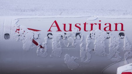 Photo for Austrian Airlines aircraft logo covered with snow - Royalty Free Image