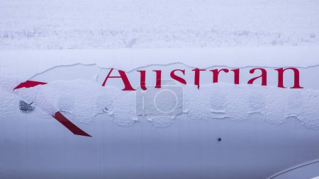 Photo for Austrian Airlines aircraft logo covered with snow - Royalty Free Image
