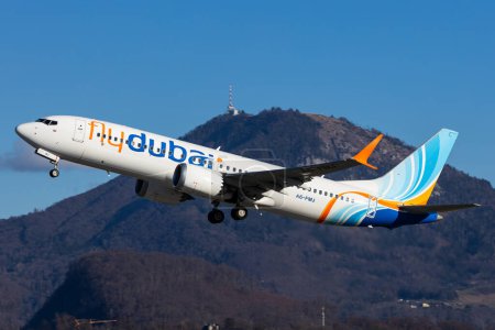 Photo for Salzburg, Austria - January 27, 2024: Dubai low cost airline Fly Dubai taking off in Salzburg with the Gaisberg mountain in the background - Royalty Free Image