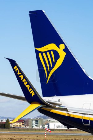 Photo for Salzburg, Austria - January 27, 2024: Airplane tail logo and winglet with Ryanair logo and corporate design - Royalty Free Image
