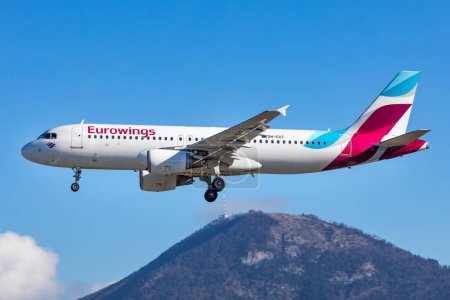 Photo for Salzburg, Austria - January 27, 2024: Low Cost airline Eurowings from Germany landing in Salzburg with the Gaisberg in the background. - Royalty Free Image